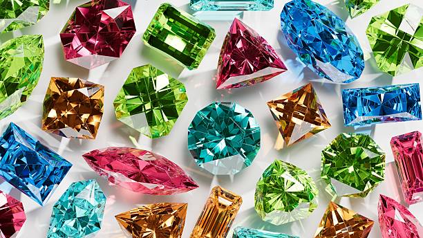 Macro texture of green, pink and blue gemstones
