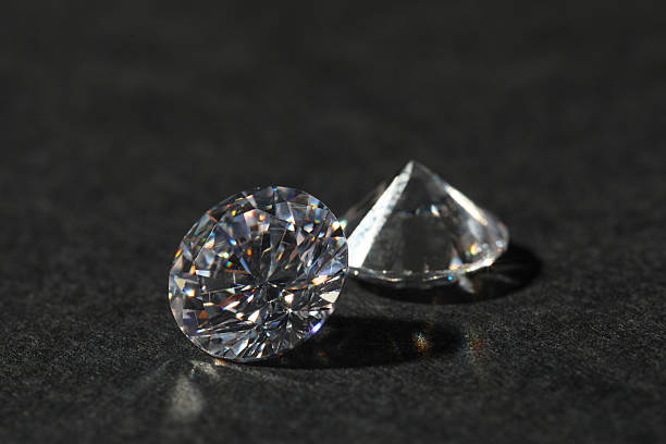 Two beautiful shiny diamond on black table